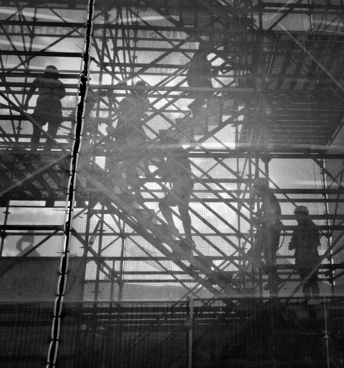 Japan OKs economic plan that allows more foreign workers