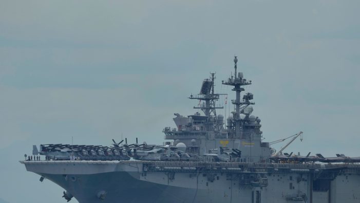 Brooklyn native reviews paperwork aboard USS Tripoli